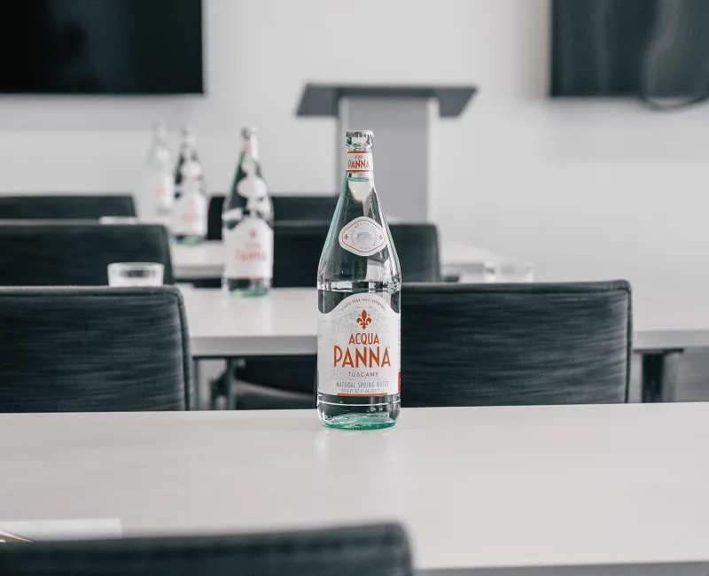 a bottle of beer sitting on top of a table